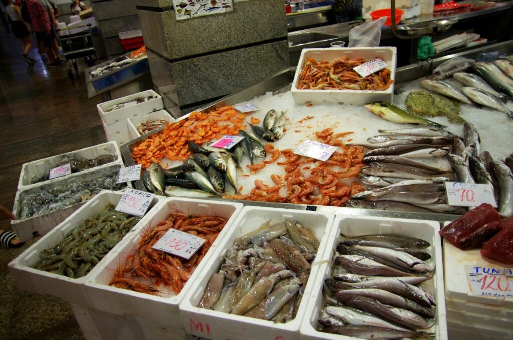 A picture of different seafood in a market